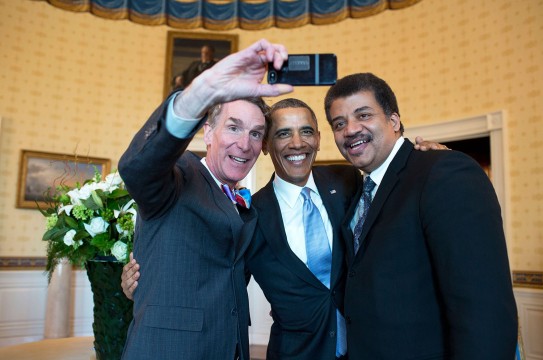 President Barack Obama poses for a selfie with Bill Nye, left, and Neil DeGrasse Tyson in the Blue Room prior to the White House Student Film Festival, Feb. 28, 2014.  (Official White House Photo by Pete Souza)

This official White House photograph is being made available only for publication by news organizations and/or for personal use printing by the subject(s) of the photograph. The photograph may not be manipulated in any way and may not be used in commercial or political materials, advertisements, emails, products, promotions that in any way suggests approval or endorsement of the President, the First Family, or the White House.